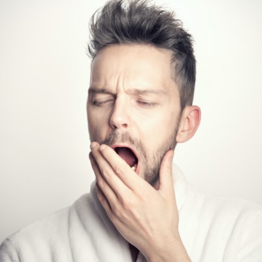 A man yawning due to exhaustion due to iron deficiency, Iron Deficiency GP in Adelaide